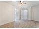 This bedroom has neutral carpet, ceiling fan, and a door leading to the bathroom at 539 Sellers Pl, Henderson, NV 89011