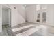 Bright living room with a staircase, large windows, and stylish modern flooring at 539 Sellers Pl, Henderson, NV 89011