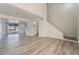 Spacious living room with modern flooring and open access to the staircase and kitchen at 539 Sellers Pl, Henderson, NV 89011