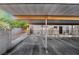 Apartment parking area, featuring numbered, covered spots, and brick accent walls at 539 Sellers Pl, Henderson, NV 89011