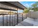 Covered parking area with black fencing and access to apartments at 539 Sellers Pl, Henderson, NV 89011