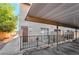 Covered apartment parking area with black fencing, set against the building's exterior at 539 Sellers Pl, Henderson, NV 89011