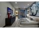 Modern bedroom with TV, contemporary dresser, a large bed, and a view of the serene outdoor space at 545 Overlook Rim Dr, Henderson, NV 89012