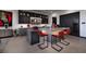 Contemporary kitchen with gray cabinets, waterfall island with seating, and modern appliances and decor at 545 Overlook Rim Dr, Henderson, NV 89012