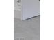 Bathroom door detail with sleek hardware and modern light gray flooring at 5655 E Sahara Ave # 1060, Las Vegas, NV 89142