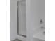 All white bath featuring tub and shower with glass enclosure at 5655 E Sahara Ave # 1060, Las Vegas, NV 89142