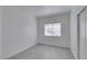 This bedroom has light grey vinyl floors, a window, and sliding door closet at 5655 E Sahara Ave # 1060, Las Vegas, NV 89142