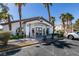 Community center building with covered entry, landscaping, and adjacent parking at 5655 E Sahara Ave # 1060, Las Vegas, NV 89142