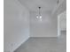 Bright dining area with modern light fixture and sleek, light gray flooring at 5655 E Sahara Ave # 1060, Las Vegas, NV 89142