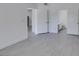 Hallway featuring access to bathroom and bedroom with modern light gray flooring at 5655 E Sahara Ave # 1060, Las Vegas, NV 89142