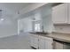 Open kitchen boasts granite counters, stainless steel appliances, and stylish, grey vinyl flooring at 5655 E Sahara Ave # 1060, Las Vegas, NV 89142