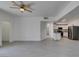 Bright and open living room featuring wood-look flooring and a glimpse into the adjacent kitchen at 5655 E Sahara Ave # 1060, Las Vegas, NV 89142
