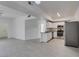 View of the open floorplan showing living space and kitchen with stainless appliances at 5655 E Sahara Ave # 1060, Las Vegas, NV 89142