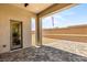 Paved backyard patio with low walls and desert landscaping; perfect for outdoor living and entertaining at 5719 Christian Creek Ct, Las Vegas, NV 89149