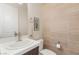 Stylish half bathroom features modern fixtures, a floating vanity and horizontal wood-look tile at 5719 Christian Creek Ct, Las Vegas, NV 89149