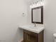 Elegant bathroom featuring a modern vanity with a white countertop and stylish light fixture at 5719 Christian Creek Ct, Las Vegas, NV 89149