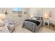 Cozy bedroom with decor, featuring a comfortable bed, matching nightstands, and serene window views at 5719 Christian Creek Ct, Las Vegas, NV 89149