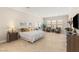 Spacious main bedroom featuring ample natural light and neutral decor at 5719 Christian Creek Ct, Las Vegas, NV 89149