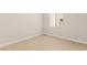 Minimalist bedroom offering ample natural light and neutral finishes on walls, baseboards, and flooring at 5719 Christian Creek Ct, Las Vegas, NV 89149