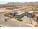 Stunning modern home with a gated entrance, three-car garage, and beautifully landscaped yard at 5719 Christian Creek Ct, Las Vegas, NV 89149