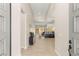 Bright foyer leading to an open-concept living space with hardwood floors and modern decor at 5719 Christian Creek Ct, Las Vegas, NV 89149