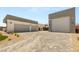 Wide driveway with multiple garage spaces showcasing the modern exterior at 5719 Christian Creek Ct, Las Vegas, NV 89149