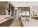 Modern kitchen with a large island, stainless steel appliances, and marble countertops at 5719 Christian Creek Ct, Las Vegas, NV 89149