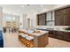 Modern kitchen with large island, stool seating, and stainless steel appliances at 5719 Christian Creek Ct, Las Vegas, NV 89149