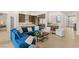 Spacious living room featuring an open floor plan, modern decor, and seamless connection to kitchen at 5719 Christian Creek Ct, Las Vegas, NV 89149