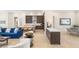 Open-concept living area showcasing seamless flow to the dining and kitchen spaces at 5719 Christian Creek Ct, Las Vegas, NV 89149