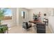 Bright office with a large window, wooden desk, and comfortable seating arrangement at 5719 Christian Creek Ct, Las Vegas, NV 89149
