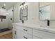 Modern bathroom with double vanity, quartz countertops, and large shower at 613 Kings Pl, Boulder City, NV 89005