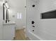 Modern bathroom with a shower and a bathtub, plus white tiling at 613 Kings Pl, Boulder City, NV 89005