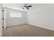 Bedroom featuring a ceiling fan, window with blinds, and neutral color palette at 613 Kings Pl, Boulder City, NV 89005