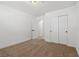 Bright bedroom featuring neutral carpet, closet, and an en-suite bathroom door at 613 Kings Pl, Boulder City, NV 89005