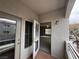 Balcony view to the interior showing living area with ceiling fan and natural light at 6160 Rumrill St # 207, Las Vegas, NV 89113