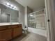 Well-lit bathroom with a shower-tub, vanity, and neutral-toned walls and flooring at 6160 Rumrill St # 207, Las Vegas, NV 89113