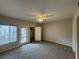 A spacious bedroom with plush carpeting, ample light, and a walk-in closet at 6160 Rumrill St # 207, Las Vegas, NV 89113