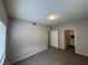 A spacious bedroom featuring neutral paint, plush carpeting, and a convenient walk-in closet at 6160 Rumrill St # 207, Las Vegas, NV 89113