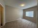 Bright bedroom with neutral walls, new carpet, and window with blinds allowing for natural light at 6160 Rumrill St # 207, Las Vegas, NV 89113