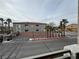 Building 6 featuring manicured palm trees and attractive landscaping at 6160 Rumrill St # 207, Las Vegas, NV 89113