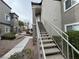View of exterior stairs leading to units, surrounded by landscaped grounds and walkways at 6160 Rumrill St # 207, Las Vegas, NV 89113