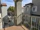 Exterior view from balcony overlooking courtyard with mature trees and neighboring buildings at 6160 Rumrill St # 207, Las Vegas, NV 89113