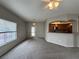 Living room with large window and view of kitchen with breakfast bar and stainless appliances at 6160 Rumrill St # 207, Las Vegas, NV 89113