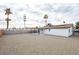 Large graveled backyard featuring a covered patio at 6170 W University Ave, Las Vegas, NV 89103
