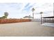 Spacious graveled backyard area featuring a covered patio at 6170 W University Ave, Las Vegas, NV 89103