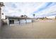 Spacious backyard with graveled area, covered patio, and privacy fence at 6170 W University Ave, Las Vegas, NV 89103