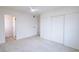 Spacious bedroom featuring neutral carpet, a closet with sliding doors, and great natural light at 6170 W University Ave, Las Vegas, NV 89103