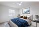 Bright bedroom features a comfortable bed, two nightstands, and a window with natural light at 6170 W University Ave, Las Vegas, NV 89103