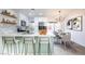 Modern kitchen with stainless appliances, sleek countertops, and an open layout with views to the backyard and dining area at 6170 W University Ave, Las Vegas, NV 89103